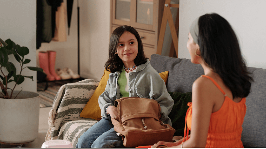 Parent listening to child during a calm conversation at home